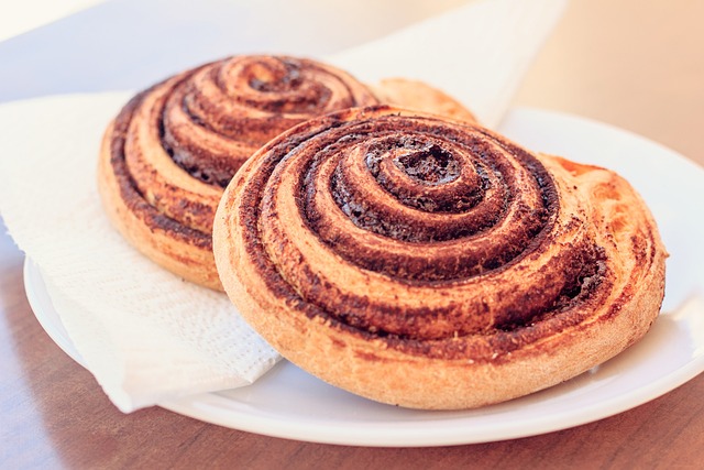 A small pile of cinnamon powder with a cat's paw print subtly visible nearby (is cinnamon bad for cats)