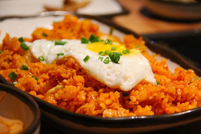 Kimchi fried rice topped with a fried egg and scallions